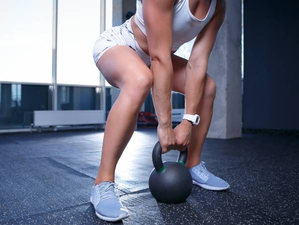 women working out at home with trainer